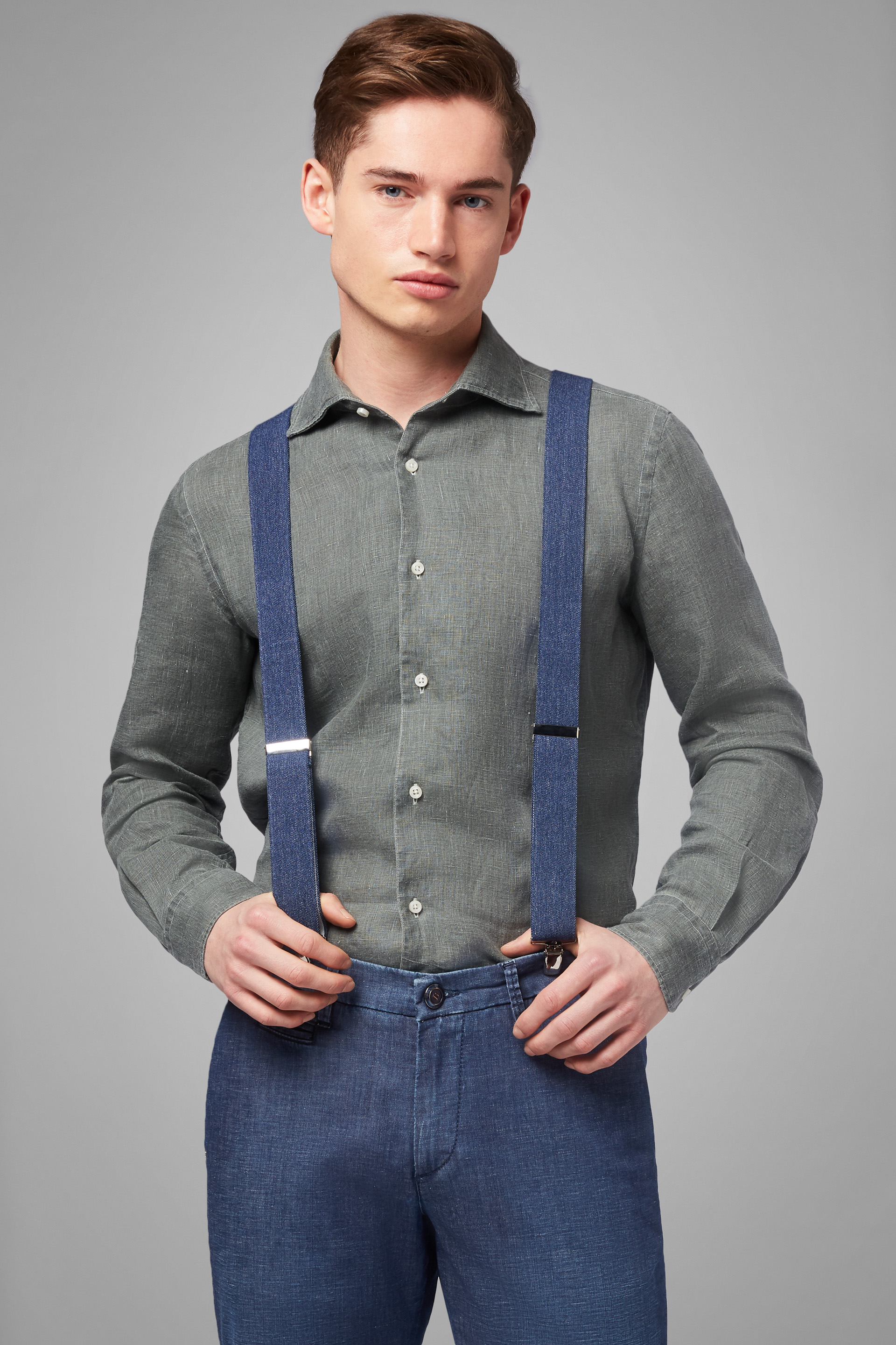 dark green shirt and blue jeans